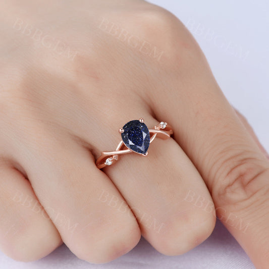 1.25ct Pear Cut Galaxy Blue Sandstone Wedding Ring In Pink Gold Twist Diamond Wedding Band