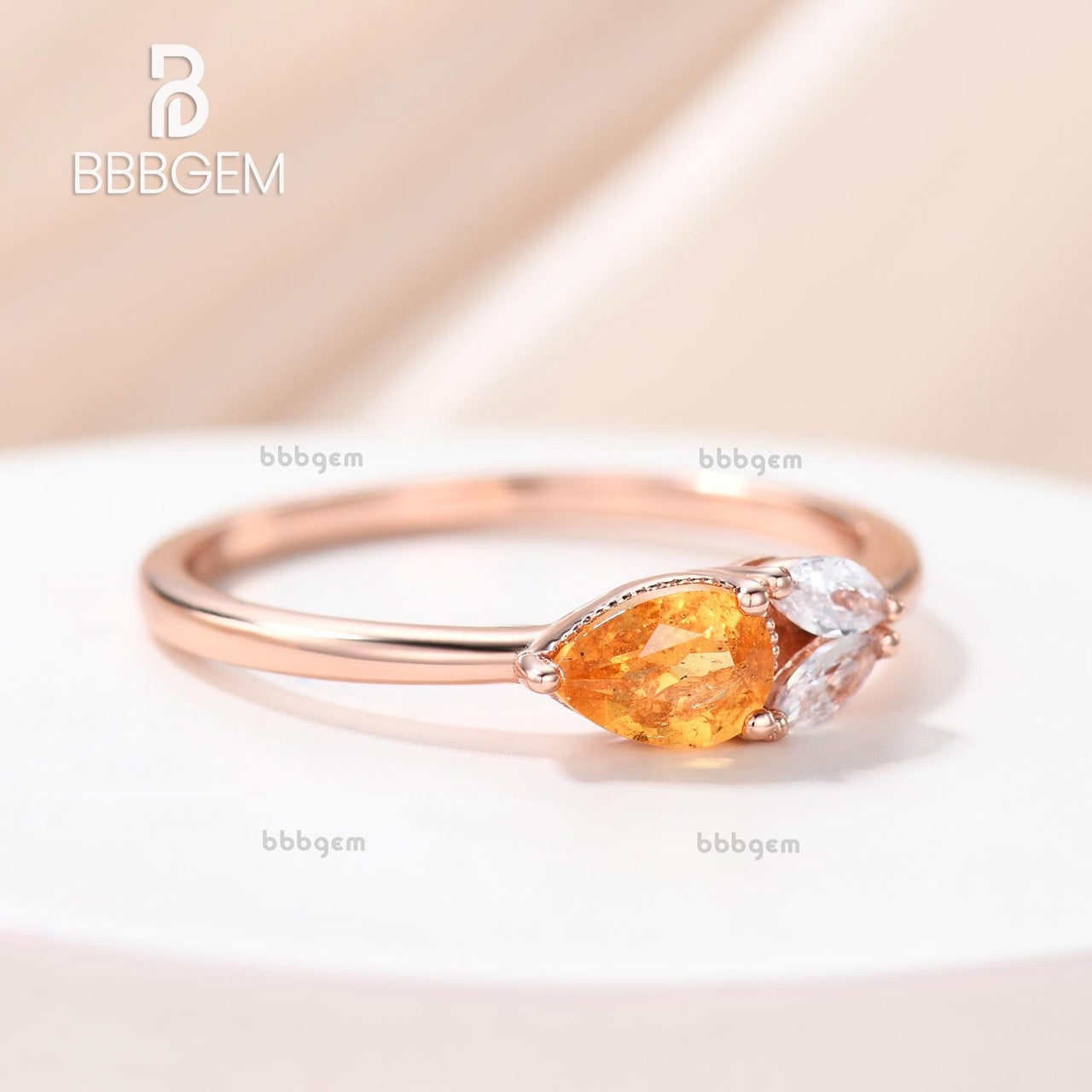 Horizontal East-West Pear Shaped Spessartite Garnet Ring with Accents Moissanite Basket Setting