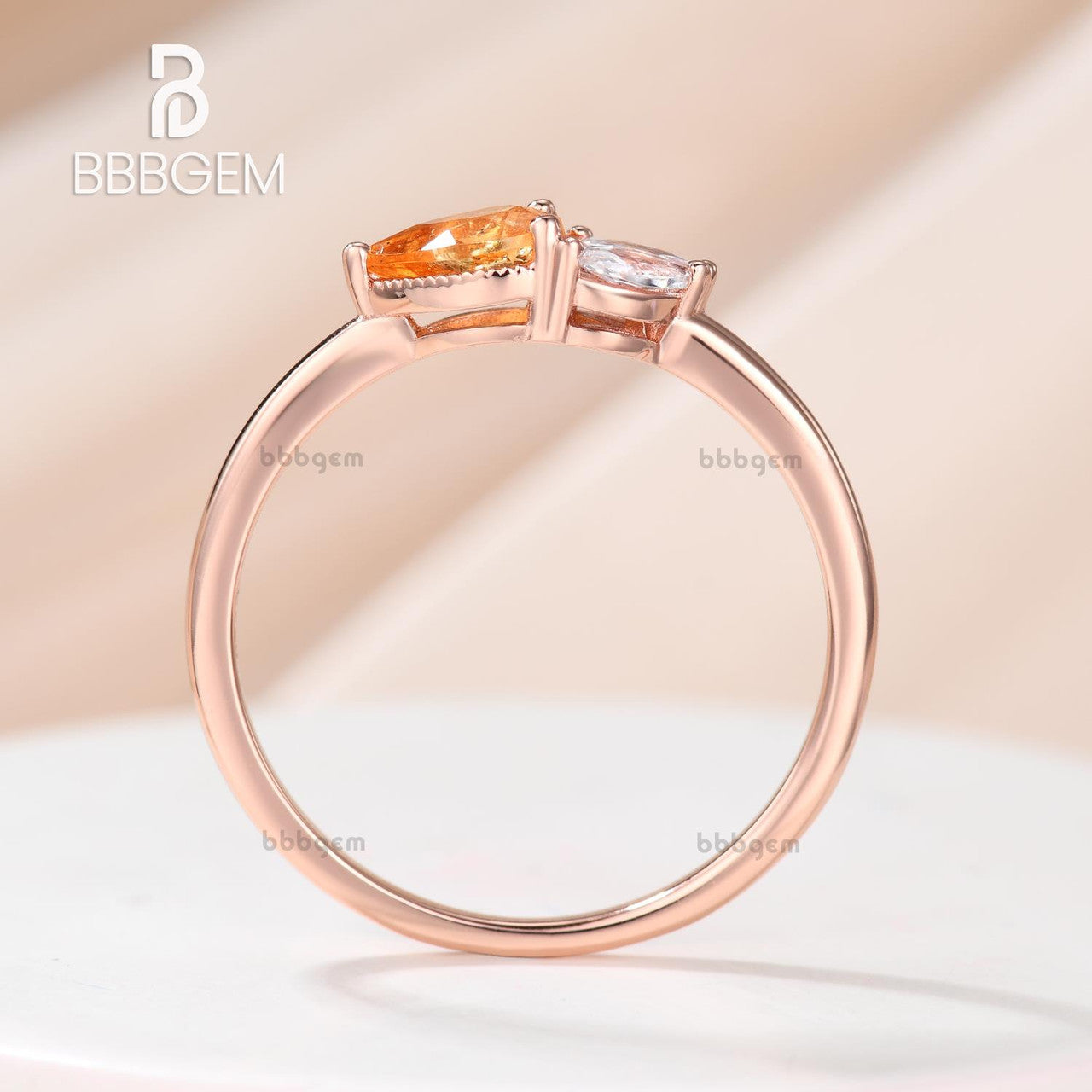 Horizontal East-West Pear Shaped Spessartite Garnet Ring with Accents Moissanite Basket Setting