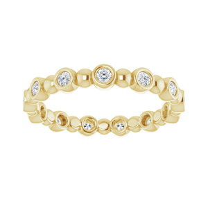3.214K Yellow Gold 1/4 CTW Diamond Bezel Set Eternity Band
