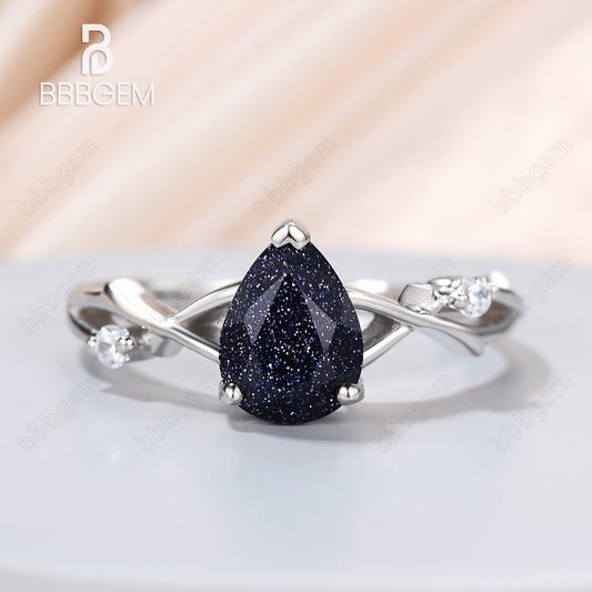 1.25ct Pear Cut Galaxy Blue Sandstone Wedding Ring In Pink Gold Twist Diamond Wedding Band