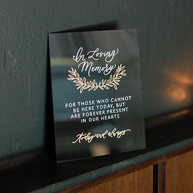 In Loving Memory Sign with Greenery Illustration