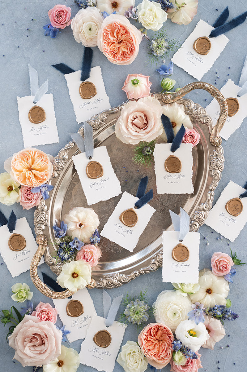 White and Navy Blue Wedding Escort Cards Cards with Torn Edges, Delicate Calligraphy Script and Wax Seal with Guest Names and Ribbon
